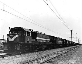 Vryheid district, 1978. SAR Class 34-600 No 34-629 heading five other locomotives and goods train.