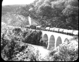 George district. A pair of SAR Class 7's on Montagu Pass viaduct in the Outeniqua mountains.