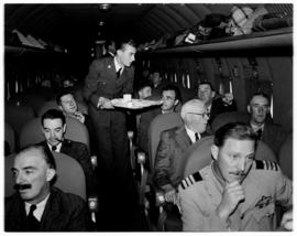 May 1946. Trip to Cape Town with SAA Douglas DC-4 Interior ZS-AUA 'Tafelberg', steward serving me...
