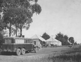 Vryheid district, 1937. SAR Thornycroft three-axle bus No 555 at Babanango with TEXACO petrol pum...