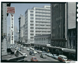 Johannesburg, 1961. Rissik Street at Burkes Bottle Store with York House opposite.