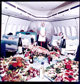 SAA Boeing 747 interior. Cabin service. Food buffet. Lobster. First class. Hostess Isabel Barnard.