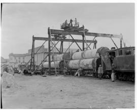 Vereeniging, May 1946. Loading large pipes onto train.