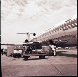 Durban, 1970. Louis Botha airport. SAA Boeing 727 ZS-SBA 'Tugela' unloading cargo.