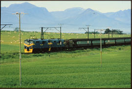 
Passenger train in open veld.
