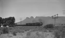 Beaufort West district, 1968. Goods train double headed by SAR Class 25 at Three Sisters.