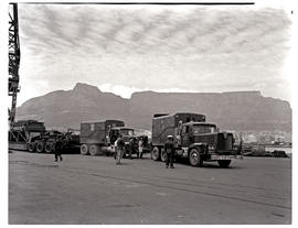 Cape Town, 1966. SAR AEC trucks No's MT18115 and MT18116 with abnormal load in Table Bay harbour.