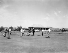 Aliwal North, 1938. Golfers on course with clubhouse in the background.