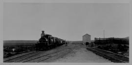 Konstabel, 1895. Train with steam locomotive at small station building. (EH Short)
