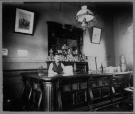 Krugersdorp. Barman at station bar counter in CSAR days.