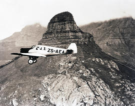 Cape Town, 1934. SAA Junkers F13 ZS-AEA 'Hendrik Swellengrebel' flying past Lion's Head. Note: Th...