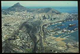 Cape Town, April 1975. Aerial view of Salt River railway complex and Table Bay Harbour. [S Mathys...