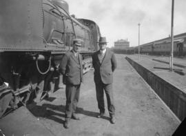 Mr Potts, locomotive foreman and Mr van der Spuy, stationmaster standing next to SAR Class GF.