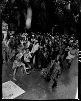 Sterkstroom, 6 March 1947. Young people dancing in the rain.