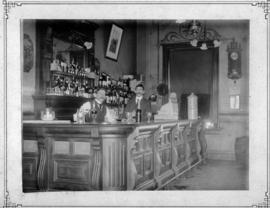 Krugersdorp. Barmen at station bar counter in CSAR days.