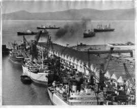 Cape Town, 12 August 1948. Weather cleared after big storm to resume moving of cargoes at Table B...
