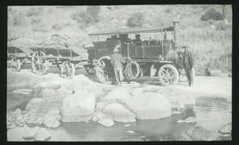 Foden steam tractor with SAR trailers taking on water.