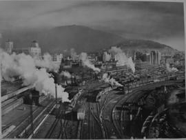 Cape Town, 1948. Many trains and locomotives in station yard.