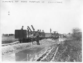 Naboomspruit district, circa 1924. Building embankment of causeway. Road-rail track. (Album on Na...