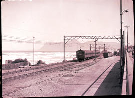 Cape Town, 1928. Sea Point suburban electric motor coach train entering Muizenberg station.