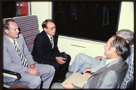 Seated in a Metroblitz train: Herbert Scheffel, Barry Lessing (left) and Minister Hendrik Schoema...