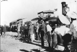 Carnarvon, 1906. Opening of Victoria West - Carnarvon railway, crowd of men next to CGR train.