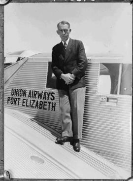 Port Elizabeth, circa 1934. Late Major Allister Mackintosh Miller standing on wing of Union Airwa...