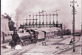 Cape Town circa 1921. SAR Class 15A with main line passenger train 7-Down leaving station with co...