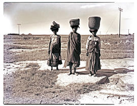 Transkei, 1948. Three women with baskets on heads.