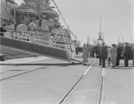Cape Town, 17 February 1947. King George VI disembarks from 'HMS Vanguard' followed by Queen Eliz...