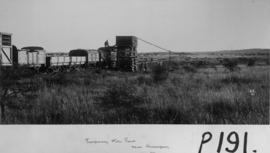Kraaipan, 1895. Locomotive taking water from temporary water tank. (EH Short)