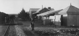 Oatlands, 1895. Railwayman posing in front of station buildings. (EH Short)