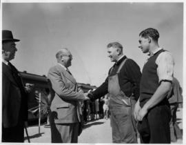 Odendaalsrus, 7 June 1948. Opening of new station. Sauer greets engine driver.