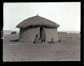 Transkei, 1932. People before typical hut.