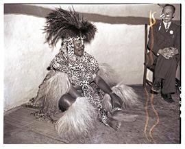 Natal, 1946. Zulu chief sitting inside hut.