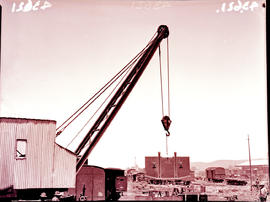 
Workshop crane lifting large steel wagon component.
