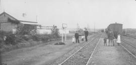 Long Hope, 1895. Railwaymen and children with train in station.