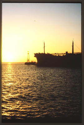 East London, August 1985. Ship leaving Buffalo Harbour at dawn. [Z Crafford]