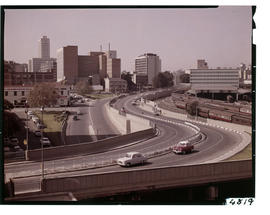Johannesburg. View of city with motorway in the foreground and Bertha Street leading to Queen Eli...