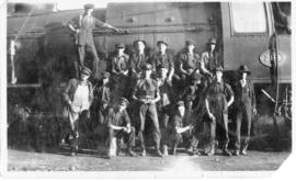 Group of men posing with SAR Class 12A No 2113.