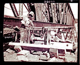 "Mossel Bay district, 1930. Construction of Gourits River bridge. Oiling winches before laun...
