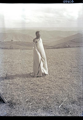 Transkei, 1932. Bomvaan man wrapped in blanket.