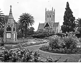 Port Elizabeth, 1950. Public gardens with church and war memorial.