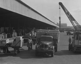 Pretoria, 1963. Heavily loaded SAR REO truck at goods shed. REO = Ransom Eli Olds Motor Car Company.