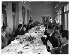 Vaal Dam, 1 May 1948. Group of about 35 men having lunch with Minister Sturrock. Members of the f...