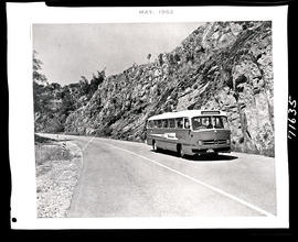 Krugersdorp district, 1962. SAR Mercedes Benz tour bus No MT16905 in road cutting.