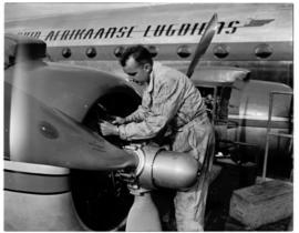 Johannesburg, August 1946. Rand Airport. Mechanic at work on SAA Douglas DC-4 Skymaster.