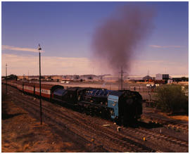 Kimberley, September 1989. SAR Class ? 'Ruebino' (?) with passenger train. [D Dannhauser]