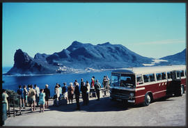 Cape Town, 1969. SAR Mercedes Benz tour bus No MT16345 and passengers overlooking Hout Bay. SAS. ...