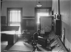 Cape Town, August 1921. New railway traffic control office. Operator at control desk.